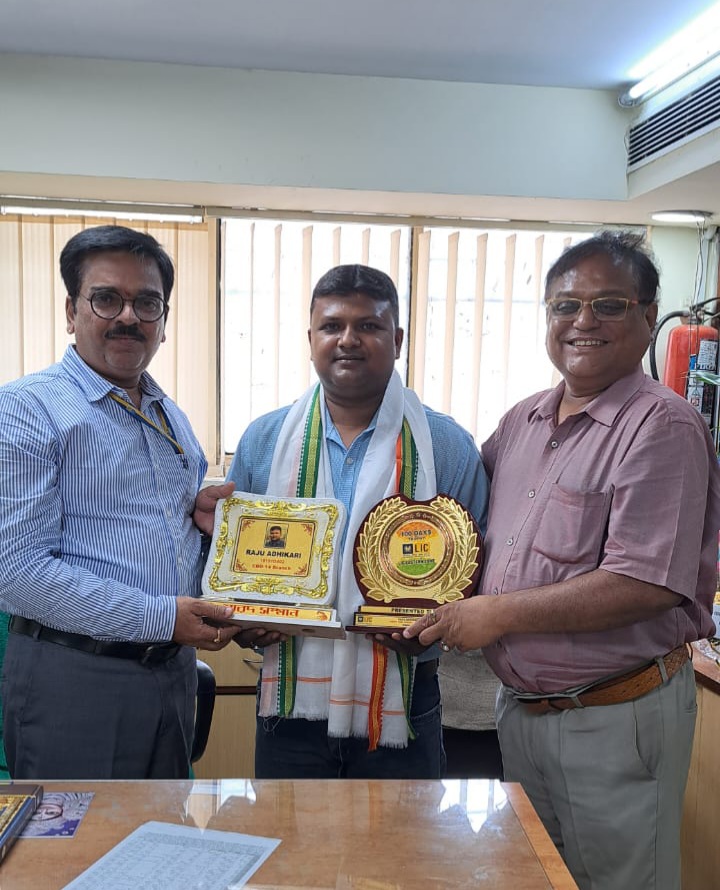 car interior from central back seat position showing driver and blurred view through windscreen of a busy road at night